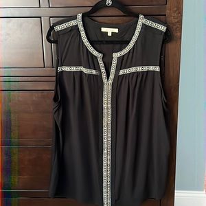 Sleeveless blouse. Worn once. Black with cute woven detail.